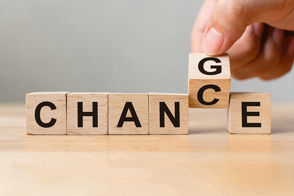 Hand flip wooden cube with word «change» to «chance», Personal development and career growth or change yourself concept